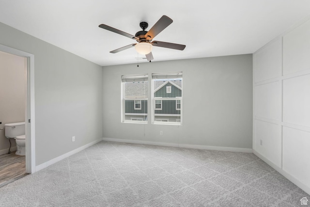 5124 W Stockfield Ln, Herriman, UT 84096 - unfurnished bedroom with light colored carpet, ensuite bathroom, and a ceiling fan