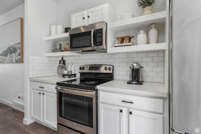 5124 W Stockfield Ln, Herriman, UT 84096 - kitchen featuring appliances with stainless steel finishes, open shelves, tasteful backsplash, light countertops, and white cabinets