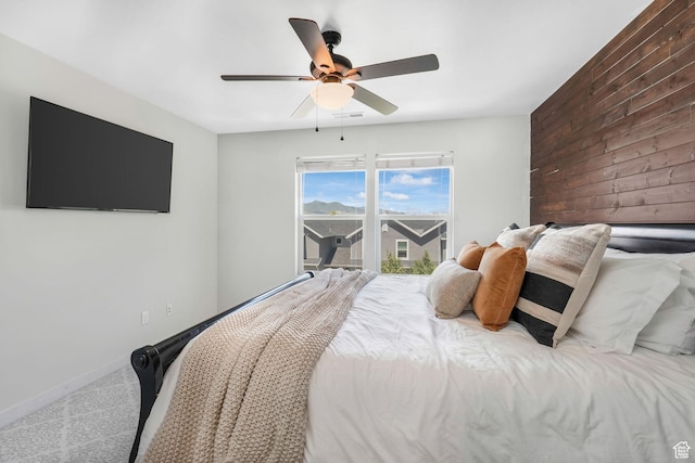 5124 W Stockfield Ln, Herriman, UT 84096 - bedroom with carpet, a ceiling fan, and wood walls