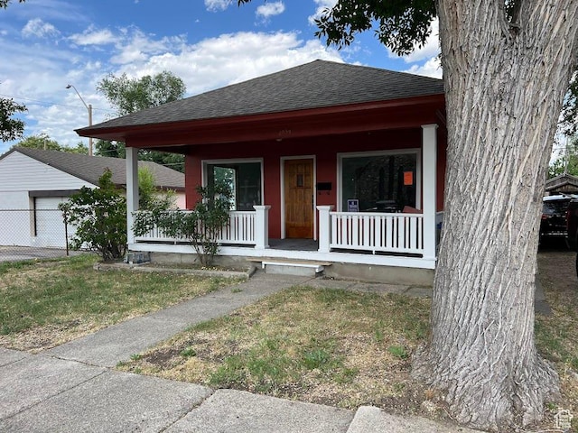 2859 S 9000 W, Magna, UT 84044 - view of front facade with a shingled roof and covered porch
