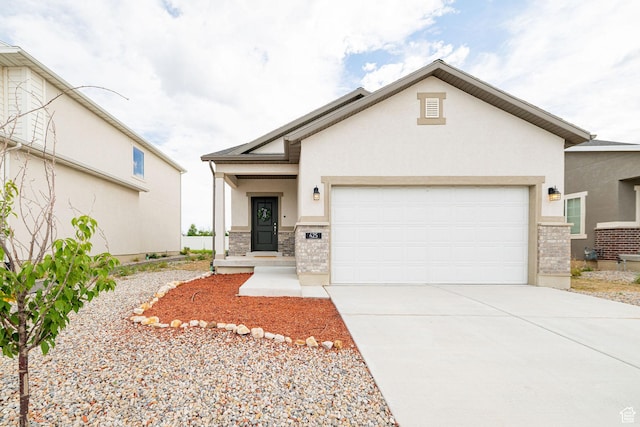 425 W Domain Ln, Grantsville, UT 84029 - view of front of property featuring stucco siding, brick siding, an attached garage, and driveway