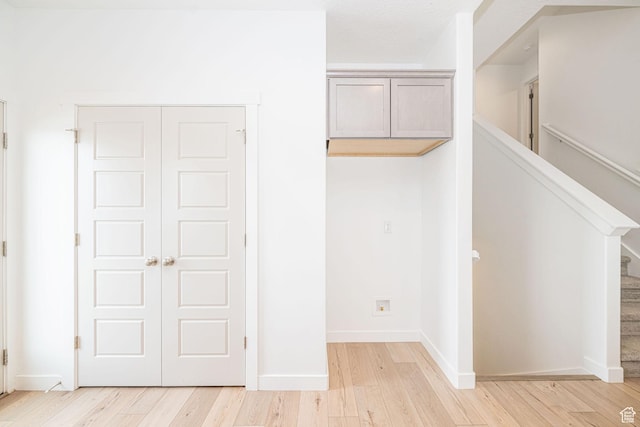 425 W Domain Ln, Grantsville, UT 84029 - hallway with light wood-style flooring and stairs