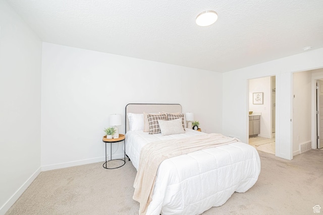 425 W Domain Ln, Grantsville, UT 84029 - bedroom with light carpet and ensuite bathroom