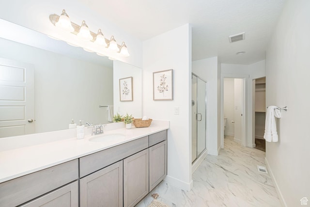 425 W Domain Ln, Grantsville, UT 84029 - full bath with marble finish flooring, a shower stall, vanity, and a spacious closet
