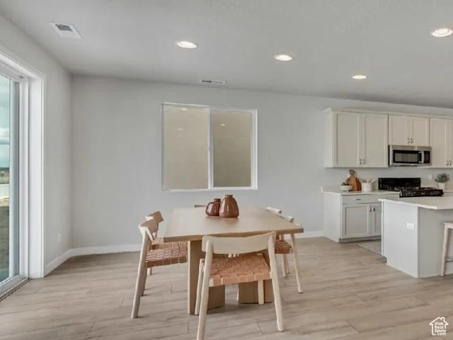 2174 W 2615 N Unit 138, Clinton, UT 84015 - dining room featuring light wood finished floors, plenty of natural light, and recessed lighting