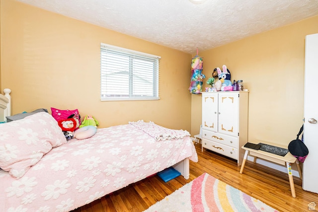 1630 S 100 E, Bountiful, UT 84010 - bedroom featuring wood finished floors and a textured ceiling