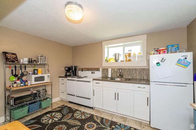 1630 S 100 E, Bountiful, UT 84010 - kitchen featuring white appliances, white cabinetry, light tile patterned floors, and backsplash