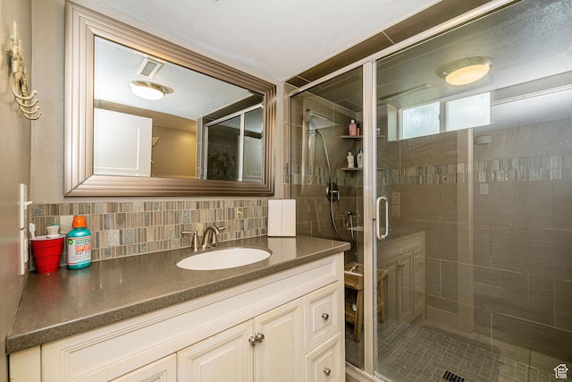 1630 S 100 E, Bountiful, UT 84010 - full bathroom featuring vanity, a stall shower, and decorative backsplash