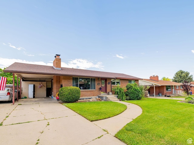 1630 S 100 E, Bountiful, UT 84010 - single story home with a chimney, brick siding, a front lawn, a carport, and concrete driveway