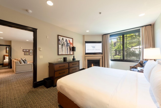 2100 W Frostwood Blvd Unit 4175, Park City, UT 84098 - bedroom featuring a glass covered fireplace, recessed lighting, and carpet floors