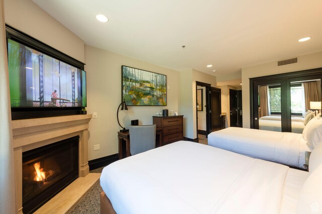 2100 W Frostwood Blvd Unit 4175, Park City, UT 84098 - bedroom featuring recessed lighting and a fireplace with flush hearth