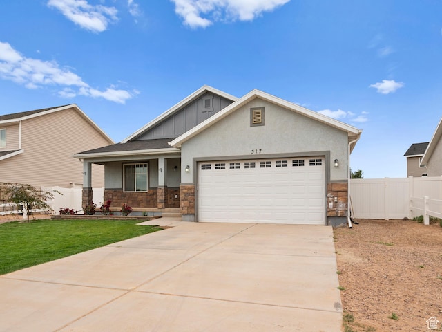 517 E 1140 S, Roosevelt, UT 84066 - craftsman inspired home featuring stone siding, a garage, board and batten siding, and covered porch