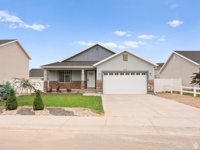 517 E 1140 S, Roosevelt, UT 84066 - craftsman house with an attached garage, stone siding, concrete driveway, board and batten siding, and a porch