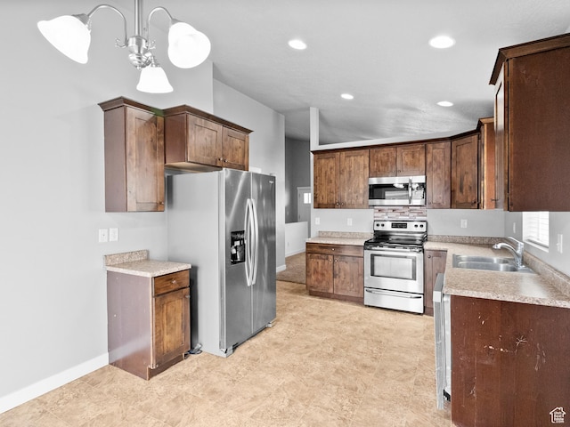 517 E 1140 S, Roosevelt, UT 84066 - kitchen featuring stainless steel appliances, light countertops, recessed lighting, hanging light fixtures, and a chandelier