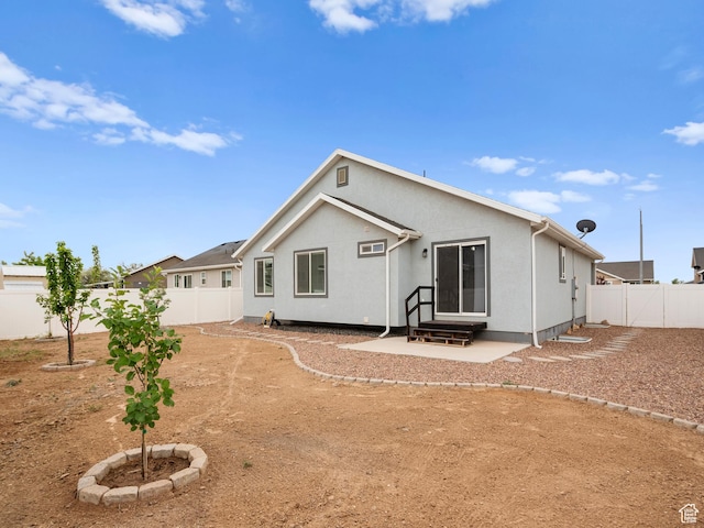 517 E 1140 S, Roosevelt, UT 84066 - back of property with a fenced backyard, entry steps, and a patio area