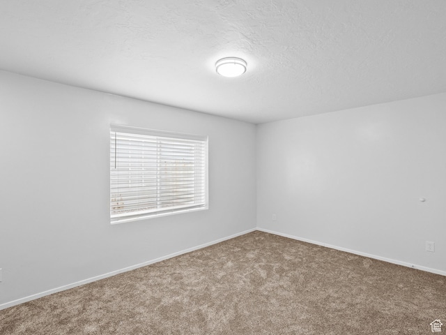 517 E 1140 S, Roosevelt, UT 84066 - spare room featuring carpet floors and a textured ceiling