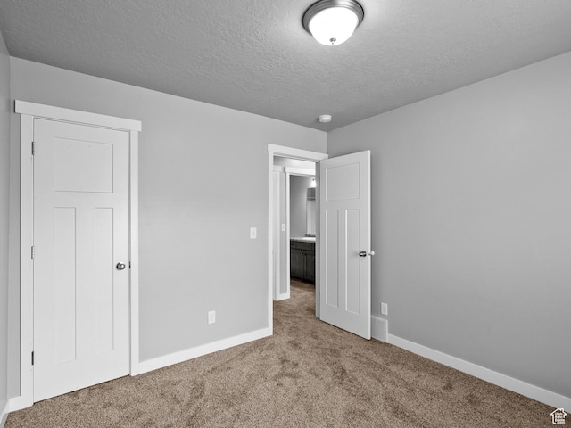 517 E 1140 S, Roosevelt, UT 84066 - unfurnished bedroom featuring carpet and a textured ceiling