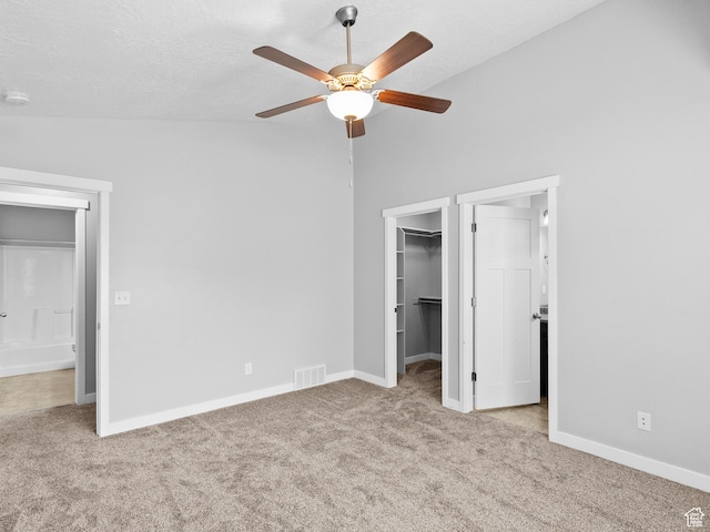 517 E 1140 S, Roosevelt, UT 84066 - unfurnished bedroom featuring carpet, a walk in closet, a closet, lofted ceiling, and ceiling fan