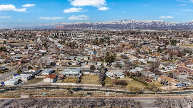 1901 W Kirkham Way S, Taylorsville, UT 84129 - aerial view of property and surrounding area featuring a mountain backdrop and nearby suburban area
