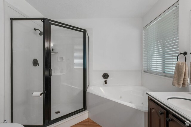 5077 W 11000 N, Highland, UT 84003 - full bath with a whirlpool tub, a stall shower, and vanity