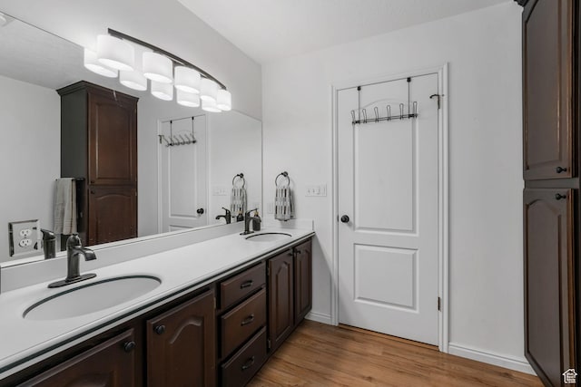 5077 W 11000 N, Highland, UT 84003 - bathroom with double vanity and wood finished floors