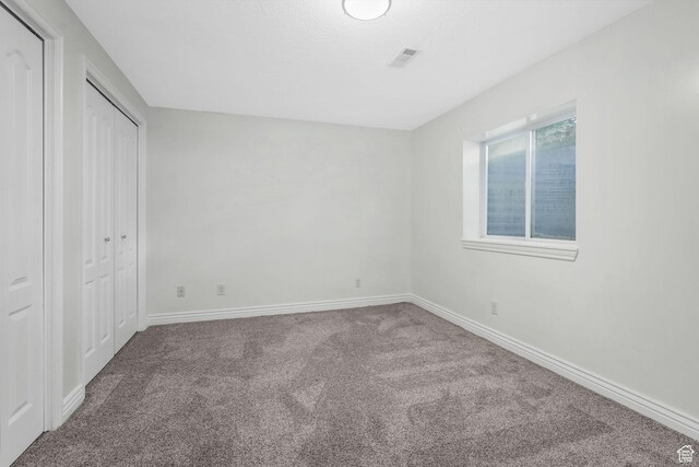 5077 W 11000 N, Highland, UT 84003 - unfurnished bedroom featuring carpet floors and a closet