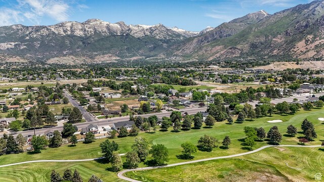 5077 W 11000 N, Highland, UT 84003 - aerial view of residential area with a local golf course and a mountain backdrop