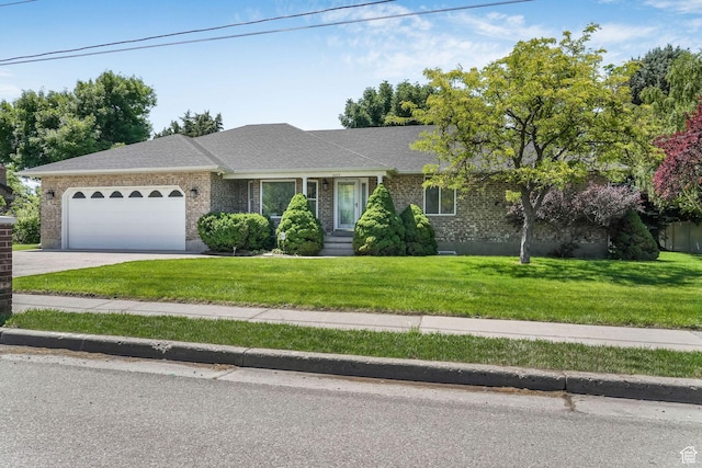 5077 W 11000 N, Highland, UT 84003 - ranch-style house with an attached garage, brick siding, driveway, a front lawn, and roof with shingles