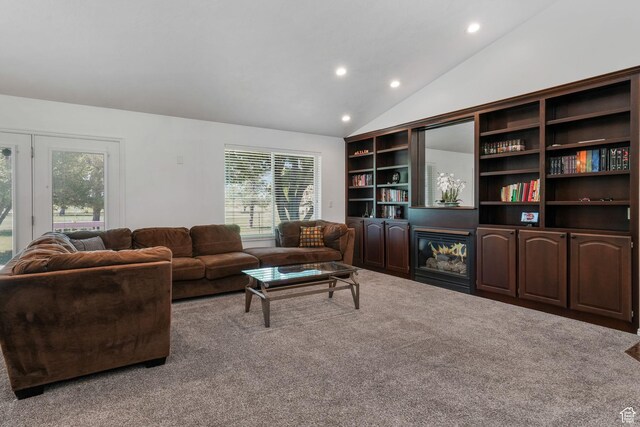 5077 W 11000 N, Highland, UT 84003 - living area featuring carpet flooring, healthy amount of natural light, vaulted ceiling, recessed lighting, and a glass covered fireplace