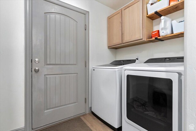 1025 N Apple Seed Ln, Santaquin, UT 84655 - laundry room with cabinet space, independent washer and dryer, and light wood-style floors