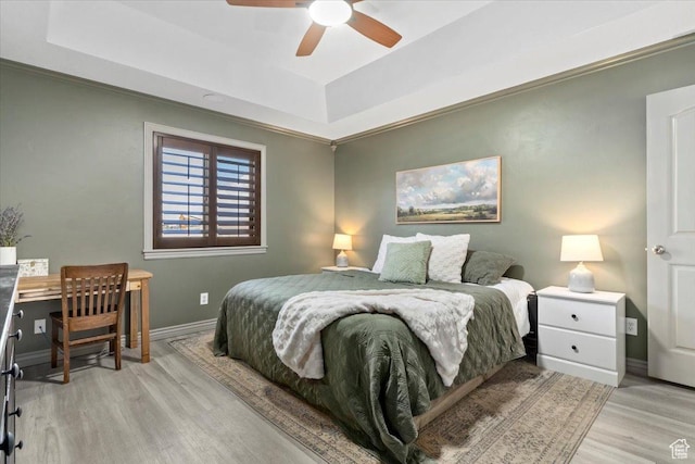 1025 N Apple Seed Ln, Santaquin, UT 84655 - bedroom with a tray ceiling, light wood-style flooring, and ceiling fan