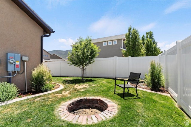 1025 N Apple Seed Ln, Santaquin, UT 84655 - fenced backyard featuring an outdoor fire pit