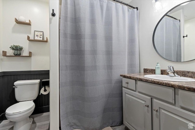 1025 N Apple Seed Ln, Santaquin, UT 84655 - full bathroom featuring vanity, a wainscoted wall, and a shower with shower curtain