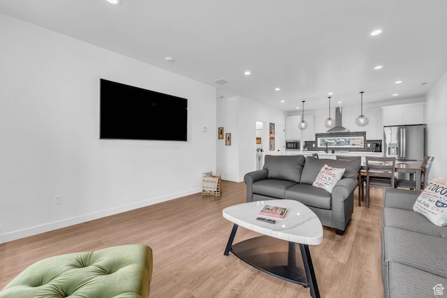 5930 Cardiff Pass Rd, Mountain Green, UT 84050 - living room featuring recessed lighting and light wood-style flooring