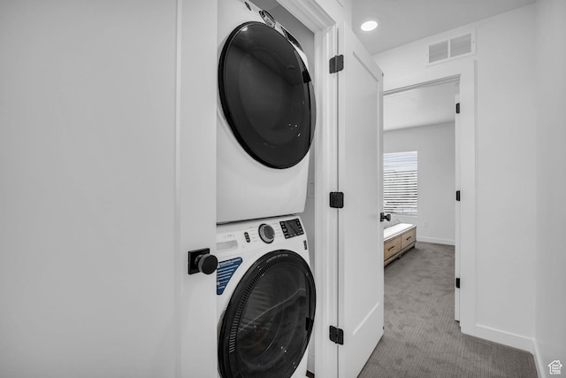 5930 Cardiff Pass Rd, Mountain Green, UT 84050 - laundry room featuring estacked washer and dryer and carpet flooring