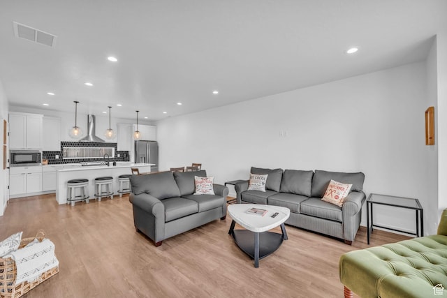 5930 Cardiff Pass Rd, Mountain Green, UT 84050 - living room with recessed lighting and light wood finished floors