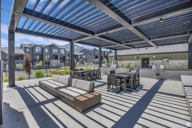 5930 Cardiff Pass Rd, Mountain Green, UT 84050 - view of patio / terrace with exterior kitchen, a residential view, outdoor dining area, a pergola, and an outdoor hangout area