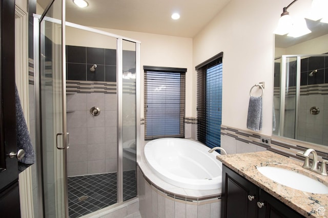 5818 N Cambridge Dr E, Mountain Green, UT 84050 - full bath with vanity, a bath, a stall shower, and recessed lighting