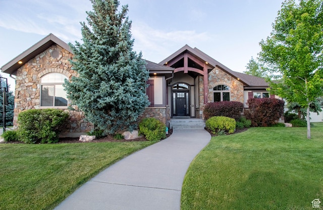 5818 N Cambridge Dr E, Mountain Green, UT 84050 - view of front of house featuring stone siding and a front yard