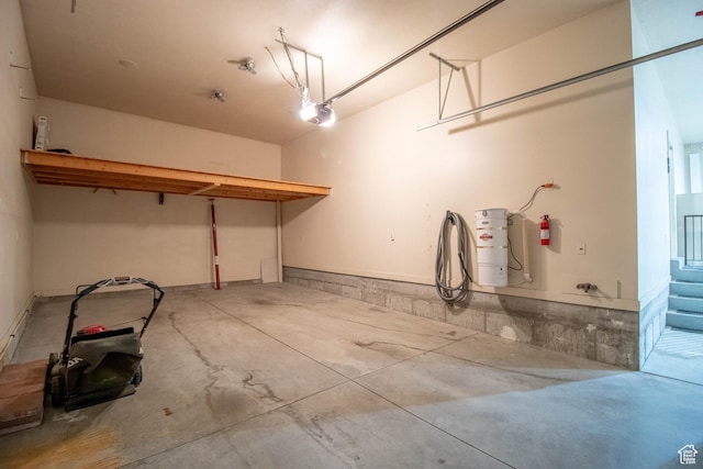 5818 N Cambridge Dr E, Mountain Green, UT 84050 - garage featuring a central vacuum unit and a garage door opener