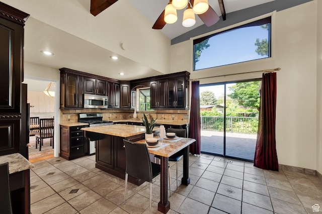 1623 E Spring Run Dr, Holladay, UT 84117 - kitchen featuring appliances with stainless steel finishes, tasteful backsplash, dark brown cabinets, recessed lighting, and a ceiling fan