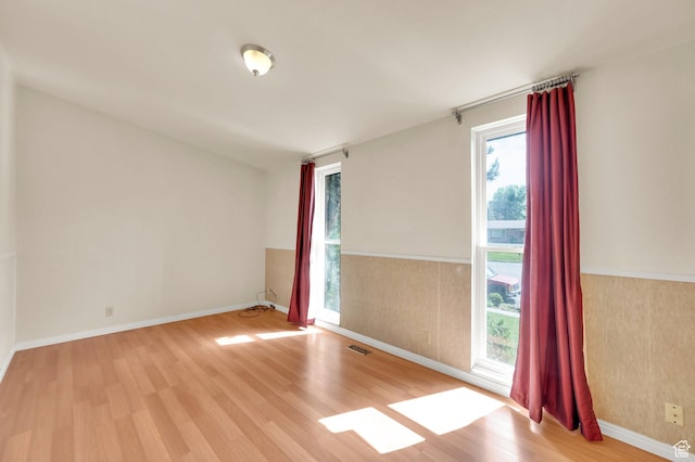 1623 E Spring Run Dr, Holladay, UT 84117 - unfurnished room featuring wood finished floors and wainscoting