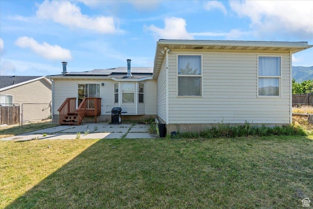 868 E Valley View Dr N, Tooele, UT 84074 - back of house with solar panels and a patio area