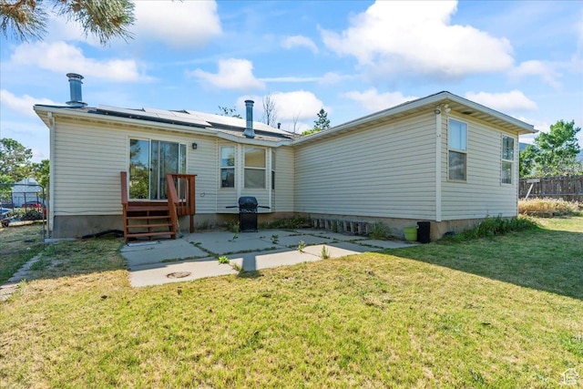 868 E Valley View Dr N, Tooele, UT 84074 - back of property featuring roof mounted solar panels and a patio