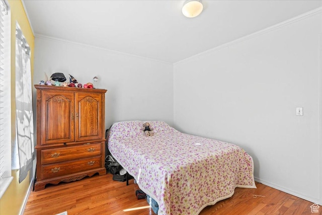 868 E Valley View Dr N, Tooele, UT 84074 - bedroom with light wood-style flooring and crown molding