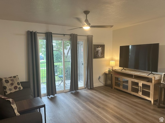 317 S 1000 W Unit 104, Pleasant Grove, UT 84062 - living room featuring wood finished floors, ceiling fan, and a textured ceiling