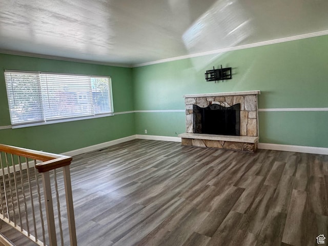 7026 S Wood Green Rd, West Jordan, UT 84084 - unfurnished living room with wood finished floors, ornamental molding, and a fireplace