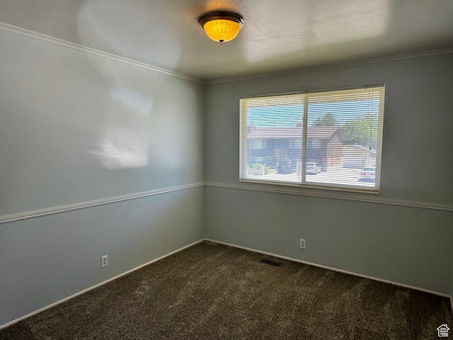 7026 S Wood Green Rd, West Jordan, UT 84084 - spare room featuring dark carpet and crown molding