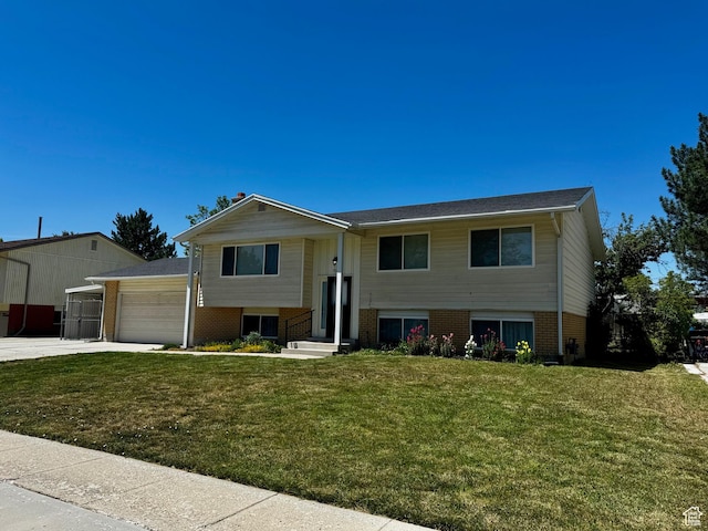 7026 S Wood Green Rd, West Jordan, UT 84084 - bi-level home featuring brick siding, an attached garage, a front yard, and concrete driveway