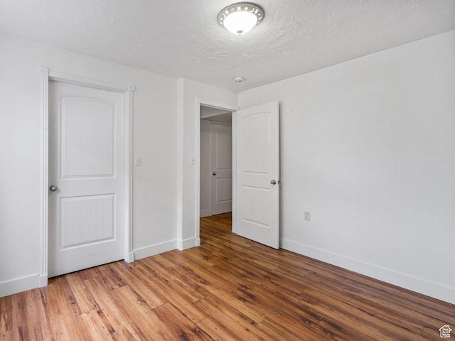 4212 N Majors St E, Eagle Mountain, UT 84005 - unfurnished bedroom with baseboards and wood-type flooring
